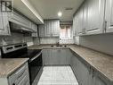 Bsmt - 14 Hashmi Place, Brampton, ON  - Indoor Photo Showing Kitchen With Double Sink 