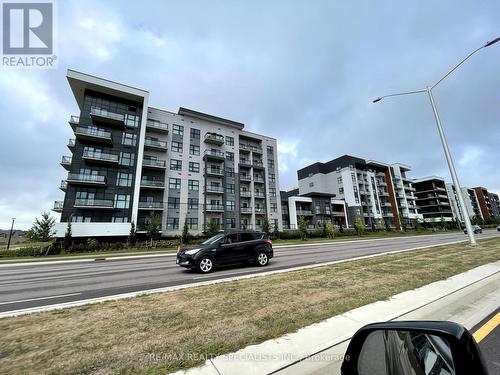 329 - 128 Grovewood Common, Oakville, ON - Outdoor With Facade