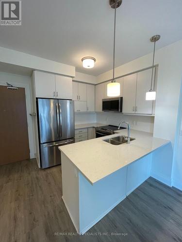 329 - 128 Grovewood Common, Oakville, ON - Indoor Photo Showing Kitchen With Stainless Steel Kitchen With Double Sink