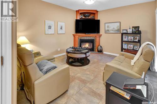 22 303 Saguenay Drive, Saskatoon, SK - Indoor Photo Showing Living Room With Fireplace