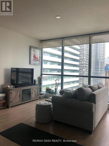 2405 - 8 Charlotte Street, Toronto, ON - Indoor Photo Showing Living Room With Fireplace