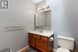 Bathroom with vanity and toilet - 