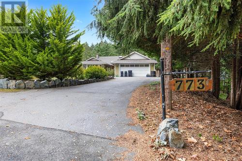 View of front facade featuring a garage - 773 Terrien Way, Parksville, BC - Outdoor