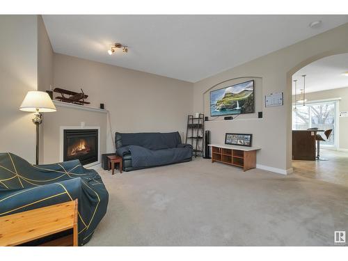 #8 13825 155 Av Nw, Edmonton, AB - Indoor Photo Showing Living Room With Fireplace