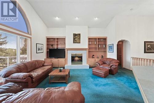 181 Hamptons Green Nw, Calgary, AB - Indoor Photo Showing Living Room With Fireplace