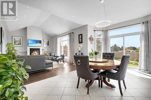 71 Riley Crescent, Centre Wellington, ON - Indoor Photo Showing Dining Room With Fireplace