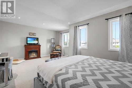 71 Riley Crescent, Centre Wellington, ON - Indoor Photo Showing Bedroom With Fireplace