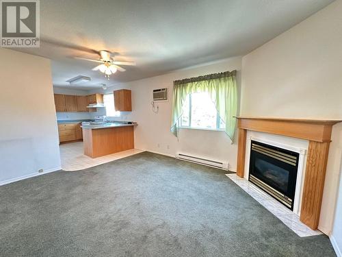 7140 4Th Street Unit# 309, Grand Forks, BC - Indoor Photo Showing Living Room With Fireplace