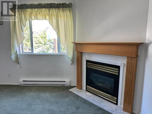 7140 4Th Street Unit# 309, Grand Forks, BC - Indoor Photo Showing Living Room With Fireplace