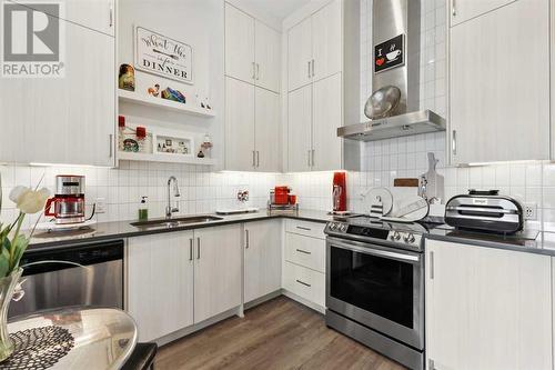 103, 12 Mahogany Path Se, Calgary, AB - Indoor Photo Showing Kitchen With Double Sink