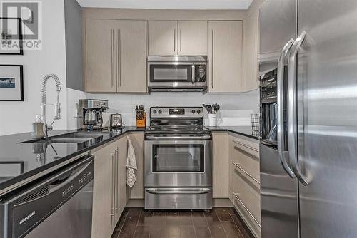 2417, 11 Mahogany Row Se, Calgary, AB - Indoor Photo Showing Kitchen With Stainless Steel Kitchen With Double Sink With Upgraded Kitchen