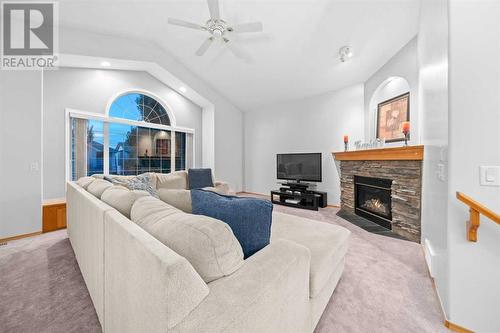 Upstairs Bonus Room - 86 Cranfield Crescent Se, Calgary, AB - Indoor Photo Showing Living Room With Fireplace