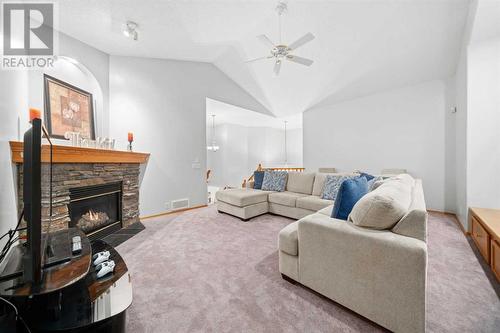 Upstairs Bonus Room - 86 Cranfield Crescent Se, Calgary, AB - Indoor Photo Showing Living Room With Fireplace