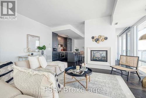 603 - 29 Queens Quay E, Toronto, ON - Indoor Photo Showing Living Room With Fireplace