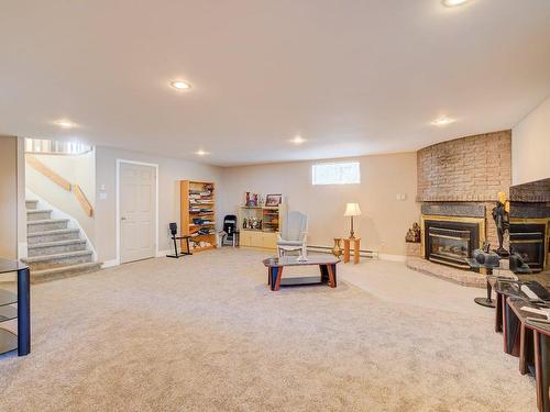 Family room - 933 Rue St-Denis, Mercier, QC - Indoor Photo Showing Basement With Fireplace