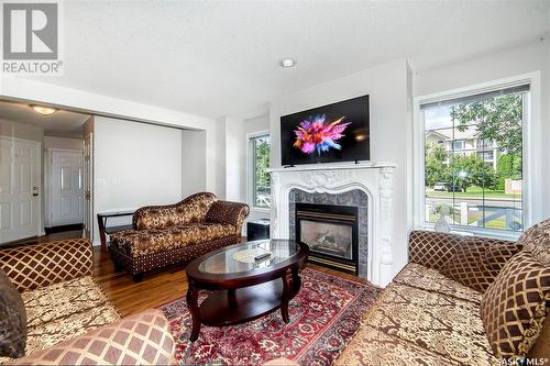 1 410 Keevil Crescent, Saskatoon, SK - Indoor Photo Showing Living Room With Fireplace