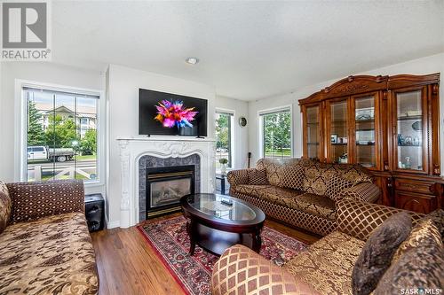 1 410 Keevil Crescent, Saskatoon, SK - Indoor Photo Showing Living Room With Fireplace