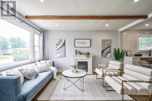 31 Warren Road, St. Catharines, ON - Indoor Photo Showing Living Room With Fireplace