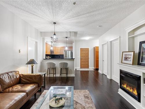 107-631 Brookside Rd, Colwood, BC - Indoor Photo Showing Living Room With Fireplace