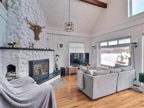 Living room - 1908 Ch. Du Village, Saint-Adolphe-D'Howard, QC - Indoor Photo Showing Living Room With Fireplace