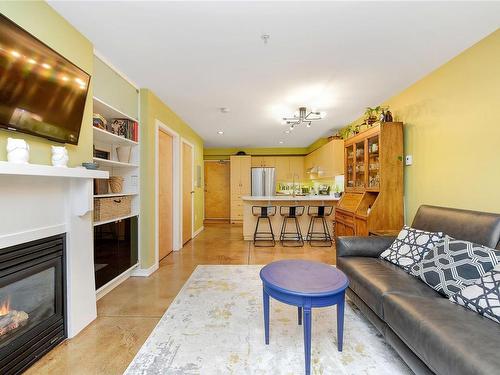 105-90 Regatta Landing, Victoria, BC - Indoor Photo Showing Living Room With Fireplace