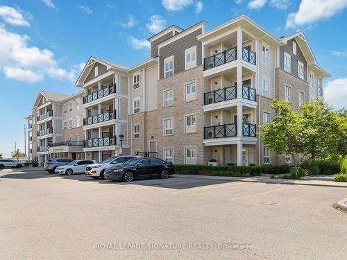 203-1005 Nadalin Hts, Milton, ON - Outdoor With Balcony With Facade