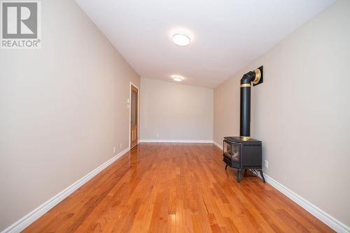 Gas stove to make this main floor family room/office an inviting space - 58 Frontenac Crescent, Deep River, ON - Indoor Photo Showing Other Room