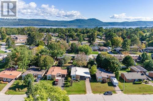 Great street close to downtown shopping, Pine Point Beach and Grouse Park - 58 Frontenac Crescent, Deep River, ON - Outdoor With Body Of Water With View