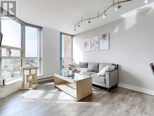 1017 - 2460 Eglinton Avenue E, Toronto, ON - Indoor Photo Showing Living Room