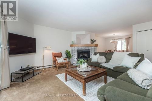 311 - 1102 Horseshoe Valley Road W, Oro-Medonte, ON - Indoor Photo Showing Living Room With Fireplace