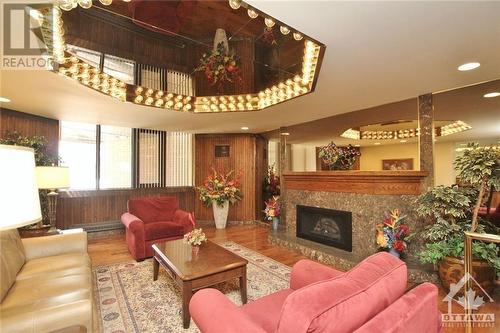 2871 Richmond Road Unit#410, Ottawa, ON - Indoor Photo Showing Living Room With Fireplace