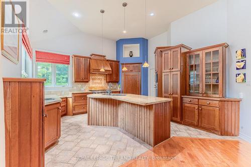 Kitchen+dining room have dual access to WI pantry - 9984 The Trail Trail, Lambton Shores (Grand Bend), ON - Indoor Photo Showing Kitchen