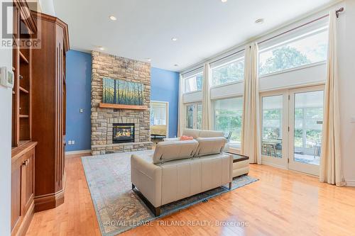 Incredible principal rooms below 12 ft ceilings - 9984 The Trail Trail, Lambton Shores (Grand Bend), ON - Indoor Photo Showing Living Room With Fireplace