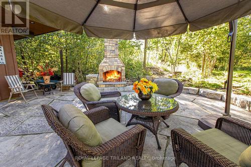 Superb outdoor fireplace with cabana structure - 9984 The Trail Trail, Lambton Shores (Grand Bend), ON - Outdoor With Deck Patio Veranda With Exterior