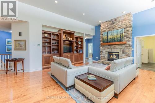 Primary open-concept living area w/ gas fireplace - 9984 The Trail Trail, Lambton Shores (Grand Bend), ON - Indoor Photo Showing Living Room With Fireplace