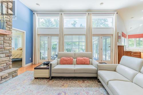 This area leads to large Strictly Sunrooms add-on - 9984 The Trail Trail, Lambton Shores (Grand Bend), ON - Indoor Photo Showing Living Room