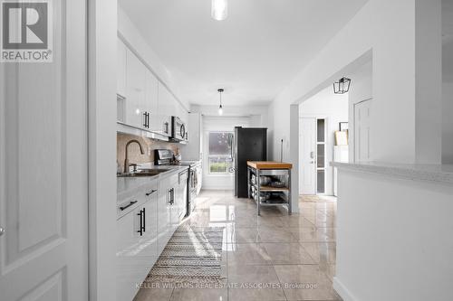 27 - 3065 Lenester Drive, Mississauga, ON - Indoor Photo Showing Kitchen With Double Sink