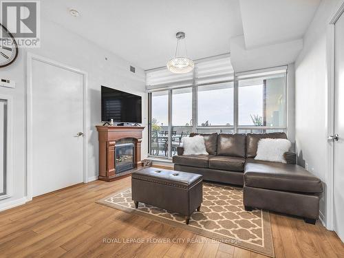 628 - 3091 Dufferin Street, Toronto, ON - Indoor Photo Showing Living Room With Fireplace