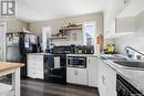 62 Charles Crescent, Regina, SK  - Indoor Photo Showing Kitchen With Double Sink 