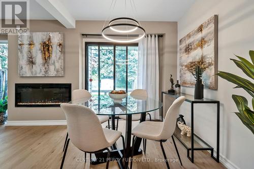 63 Springhouse Square, Toronto, ON - Indoor Photo Showing Dining Room With Fireplace