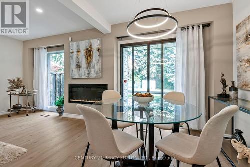 63 Springhouse Square, Toronto, ON - Indoor Photo Showing Dining Room With Fireplace