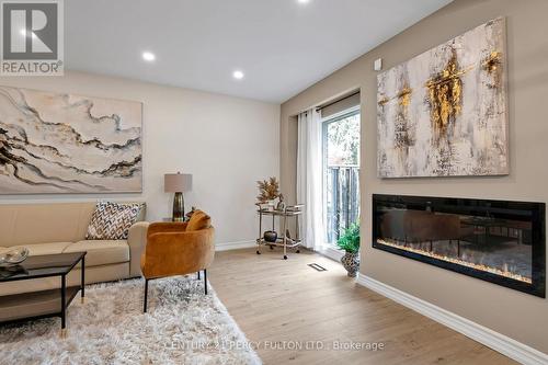 63 Springhouse Square, Toronto, ON - Indoor Photo Showing Living Room With Fireplace