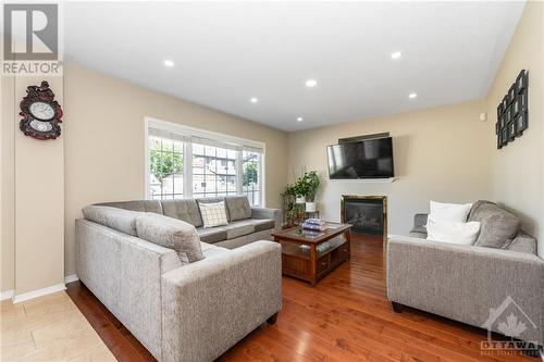 247 Lucinda Crescent, Ottawa, ON - Indoor Photo Showing Living Room With Fireplace