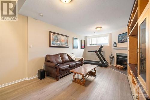 6057 Pineglade Crescent, Ottawa, ON - Indoor Photo Showing Living Room With Fireplace