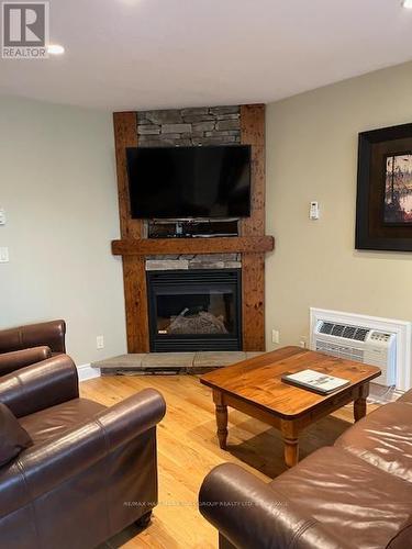 107 - 4 - 1052 Rat Bay Road, Lake Of Bays, ON - Indoor Photo Showing Living Room With Fireplace