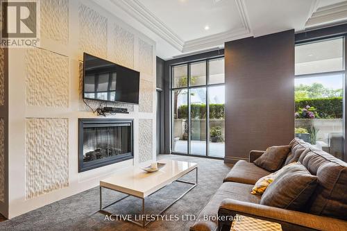 202 - 3563 Lake Shore Boulevard W, Toronto, ON - Indoor Photo Showing Living Room With Fireplace