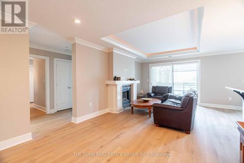 405 - 340 Sugarcreek Trail, London, ON - Indoor Photo Showing Living Room With Fireplace