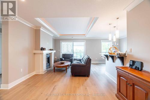 405 - 340 Sugarcreek Trail, London, ON - Indoor Photo Showing Living Room With Fireplace