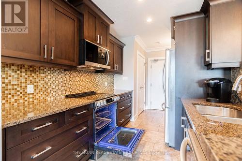 405 - 340 Sugarcreek Trail, London, ON - Indoor Photo Showing Kitchen With Double Sink