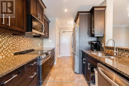 405 - 340 Sugarcreek Trail, London, ON - Indoor Photo Showing Kitchen With Stainless Steel Kitchen With Double Sink With Upgraded Kitchen